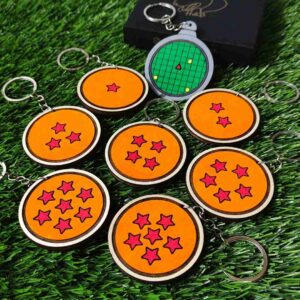 Kit de porta-chaves Dragon Ball com designs das Esferas do Dragão e Radar do Dragão, feito em madeira de reflorestamento, cortado e gravado a laser e pintado à mão com tinta acrílica. / Dragon Ball keychain set featuring Dragon Balls and Dragon Radar designs, made from reforested wood, laser cut, engraved, and hand-painted with acrylic paint.